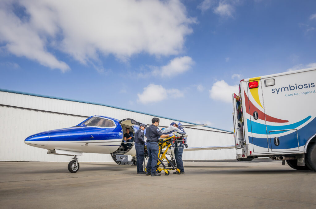 Emergency team loading patient