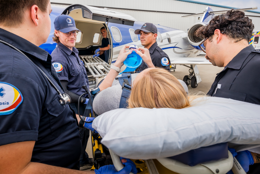 Paramedics assist patient boarding