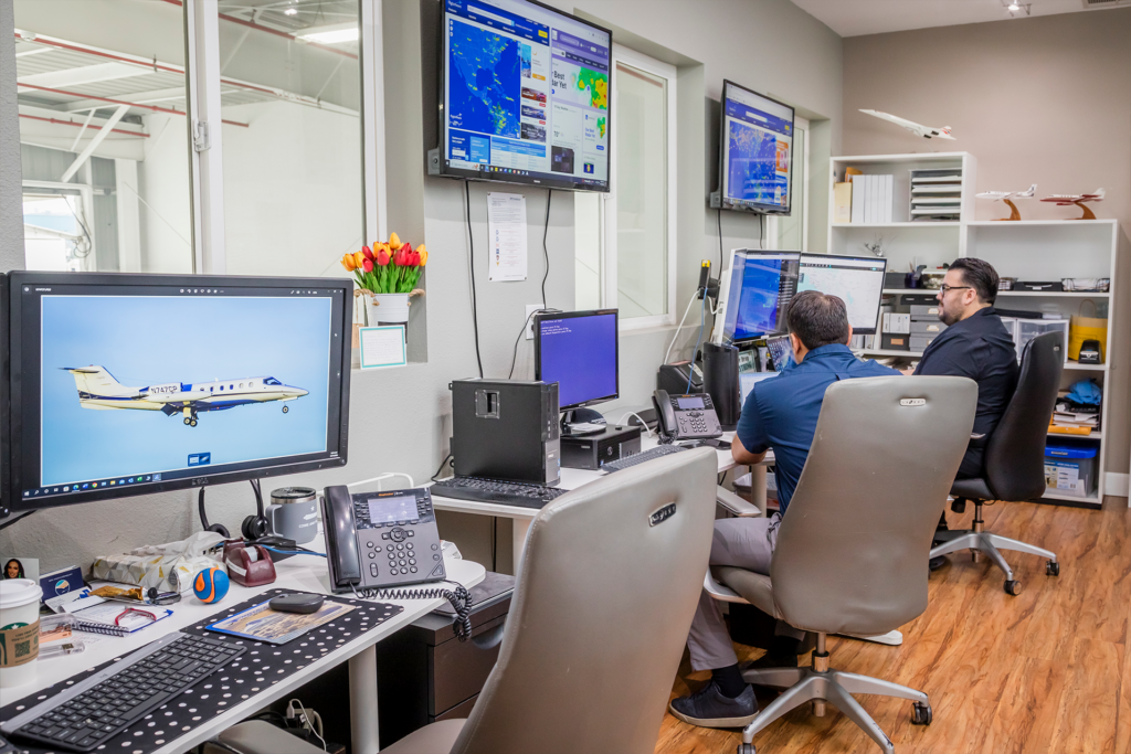 Two men monitoring aircraft systems